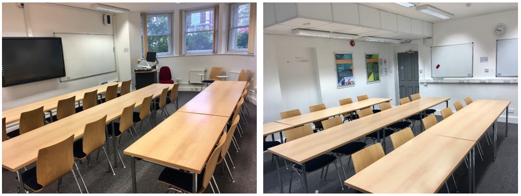 Classroom with rows of tables and chairs.